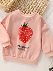 Pink children's sweatshirt with a strawberry graphic and text on a light background