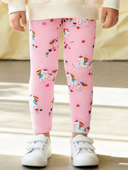 Pink leggings with unicorn pattern worn by a child, standing on a neutral background