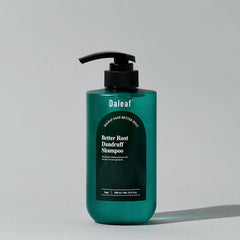 Green shampoo bottle with black pump labeled 'Daleaf' on a light gray background