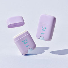 Purple wax container with 'Stick Wax' text on a light blue background