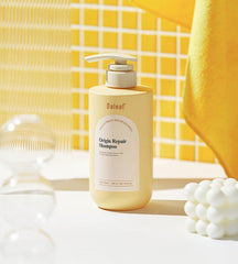 Daleaf Origin Repair Shampoo bottle on a white surface with a yellow checkered curtain in the background