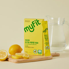 Yellow 'myfit' packaging with lemons and a glass pitcher on a beige background