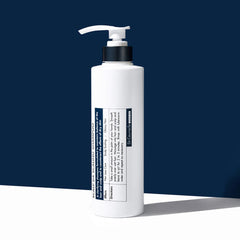 White bottle with pump on a blue background