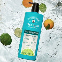 Dr. Groot shampoo bottle with citrus elements on a water background