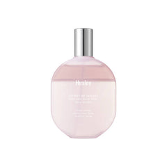 Pink bottle with silver cap on a white background