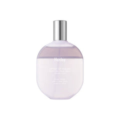 Perfume bottle with a silver cap on a white background
