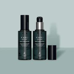 Two bottles of Kahi Hair Care Moist Shine Hair Oil on a light gray background