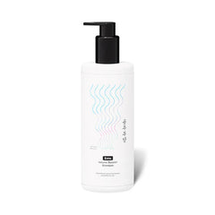 White shampoo bottle with black pump on a white background