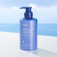 Blue bottle of KUNDAL Airy Volume Hyaluron Treatment with a blue and white background