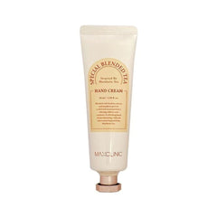 A squeeze tube of MAYCLINIC Special Blended Tea Hand Cream, featuring a warm cream-colored body with a tan label and a metallic rose gold cap, set against a plain white background.