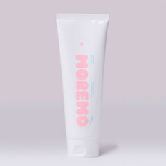 White tube with 'moremo' branding on a light gray background