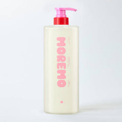 Bottle of MOMEMO with a pink pump on a white background