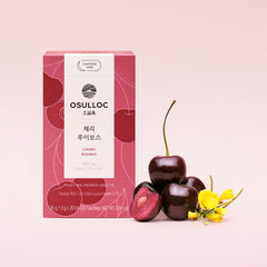 OSULLOC cherry rooibos tea box with cherry fruits and a yellow flower on a pink background