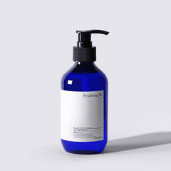Blue shampoo bottle with pump on a light gray background